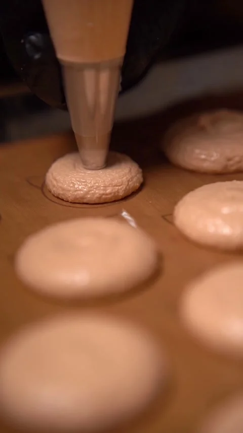 Pastry Chef Pouring Dough onto a Baking Tray. Baking French Sweet Dessert Macaro Stock Footage 294720462