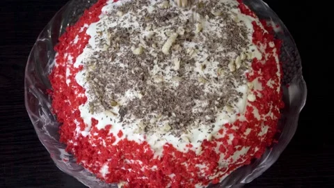 The pastry chef prepares a beautiful cake and sprinkles it with grated nuts and Video stock 152972071