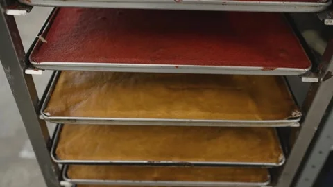 Pastry chef preparing red velvet cake layers in bakery Stock Footage 300083962