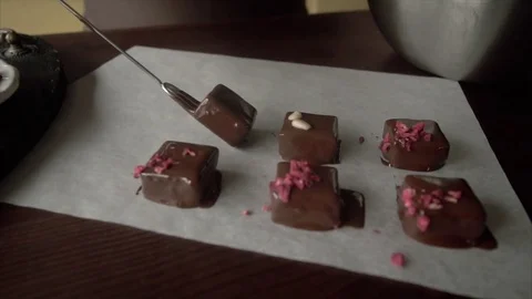 The pastry chef puts fresh handmade candies on the table with a special tool Stock Footage 72529363