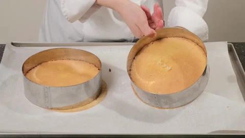 Pastry chef remove cake from the mold, after baking. Stock Footage 150936978