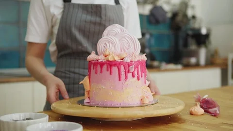 Pastry chef rotating stand with ready cake Stock Footage 108878118