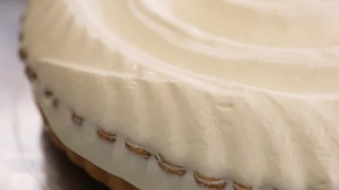 Pastry Chef Spreading Smooth White Cream Coating on Gourmet Dessert Pie Stock Footage 337751507