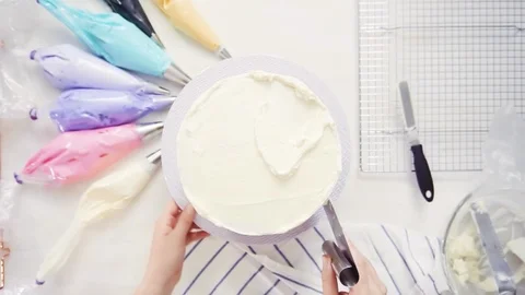 Pastry chef stacking cake layers Stock Footage 95620629