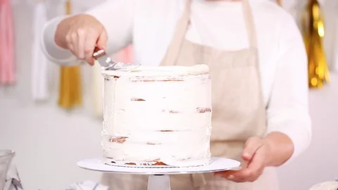 Pastry chef stacking cake layers Stock Footage 95621749