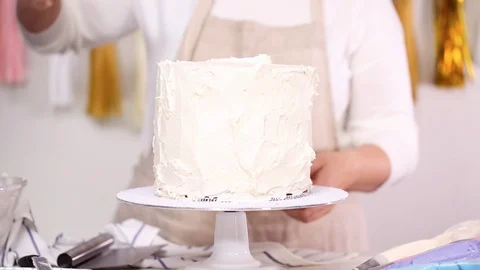 Pastry chef stacking cake layers Stock Footage 95622326