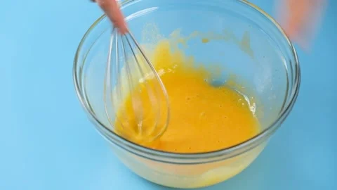 Pastry chef use wire whisk mixing meringue egg for bakery. Stock Footage 152383809