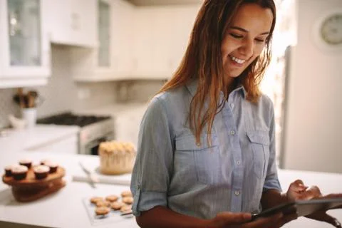 Pastry chef using digital tablet in kitchen Stock Photos