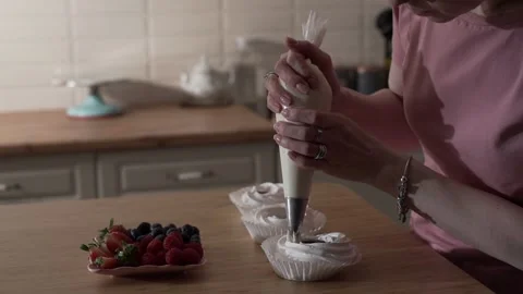 The pastry chef using a pastry bag for a cake medium shot Video stock 130356639