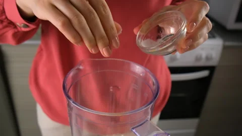 Pastry chef woman hands adding spices to blender cooking on kitchen. Stock Footage 317232946