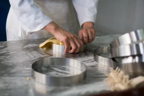 Pastry Chefs Hands Puling Pie Dough Stock Photos