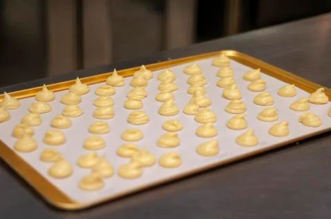 Pastry dough on a baking sheet Stock Photos