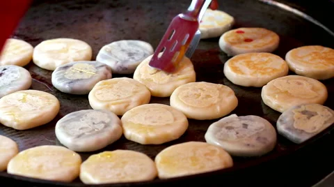 Pastry dough, fried in the hot pan. Stock Footage 56229706