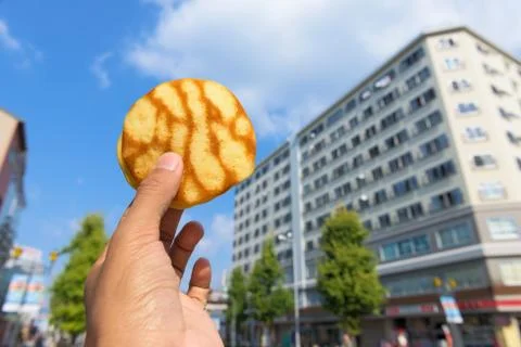 Pastry in hand Stock Photos