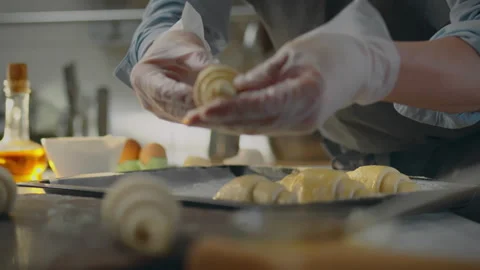 Pastry. In new type of bakery, baker in an apron painstakingly creates fragr Stock Footage 281104304