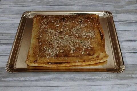 A pastry with nuts on top of it Stock Photos