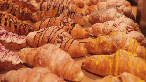 Pastry store display. Hot and crispy baked goods. Sweet treat from the Stock Footage 259797833
