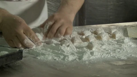 Pastry at work while preparing dough for desserts Stock Footage 75869614