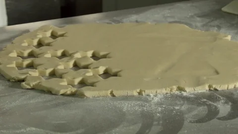 Pastry at work while preparing star shaped biscuits Stock Footage 75869560
