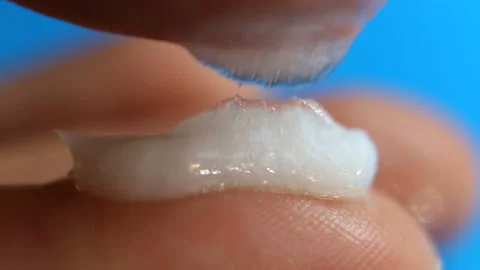 Pasty white translucent cream of uniform texture, based on fat or water, viscous Stock Footage 128996875