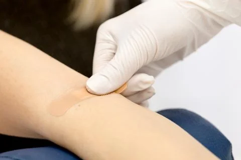 Patch on the arm after taking blood from a vein Stock-Fotos