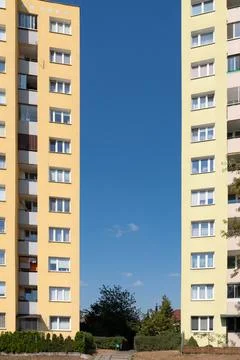 A patch of blue sky seen between two high-rise residential buildings 写真素材