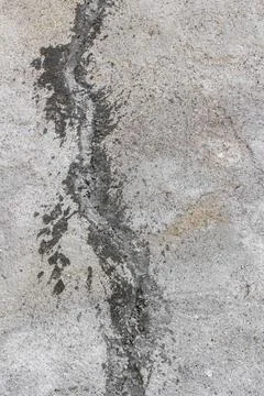 Patch of concrete Crack in the wall filled with concrete patch. Copyright:... Stock Photos