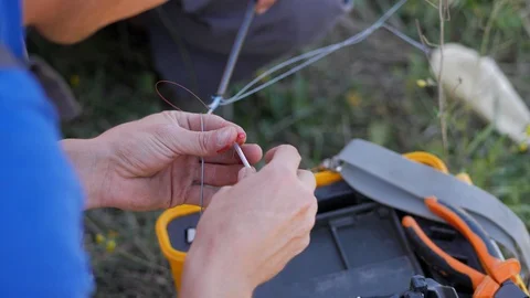 Patch cord. Soldering of optic fiber.Master of Internet service provider company Stock Footage 128037784
