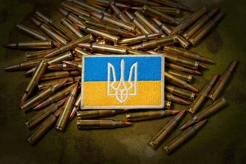 Patch with the flag and coat of arms of Ukraine, rifle cartridges on a Stock Photos