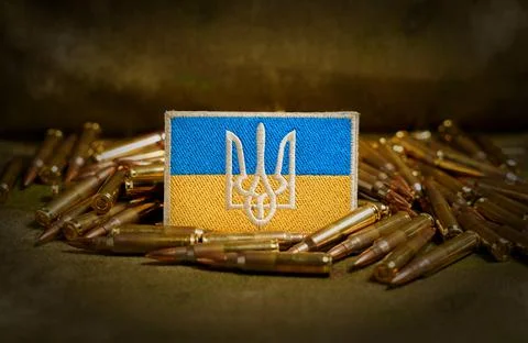 Patch with the flag and coat of arms of Ukraine, rifle cartridges on a Stock Photos
