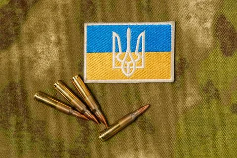 Patch with the flag and coat of arms of Ukraine, rifle cartridges on a Stock-Fotos