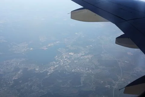 A patch of ground under the wing of an airplane. Stock Photos