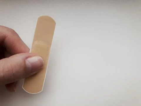 Patch in hand on a white background. Stock Photos