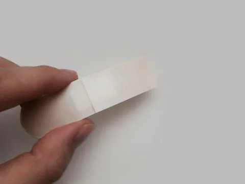 Patch in hand on a white background. Stock Photos