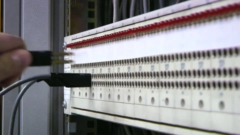 Patch panel, engineer insert-remove patch cord. Hands. Stock Footage 82469153