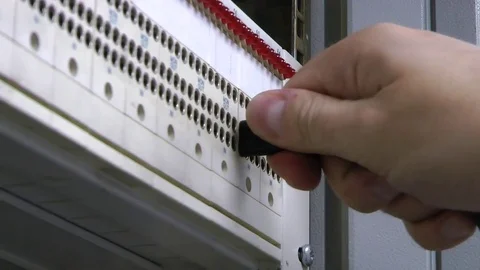 Patch panel, engineer insert-remove patch cord. Hands. Video stock 82469411