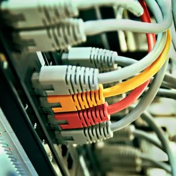 Patch Panel server rack with gray yellow and red  cords Stock-Fotos