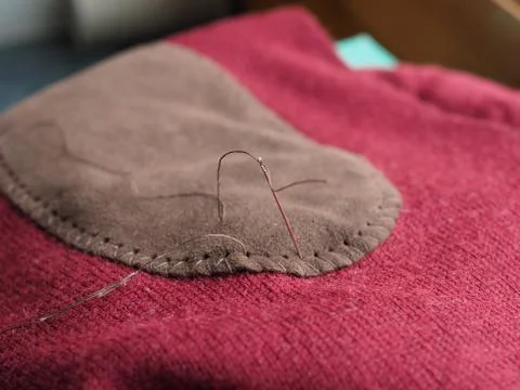 Patch sewing with selective focus on needle 写真素材