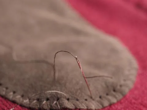 Patch sewing with selective focus on needle 写真素材