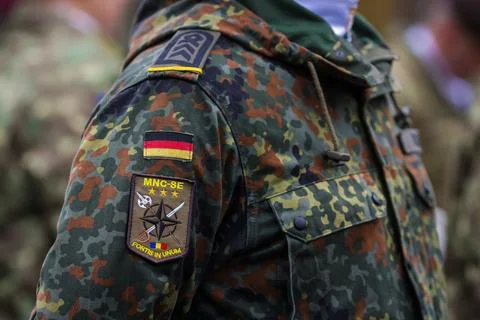 Patch on the uniform of a German soldier preparing to attend the Romanian N.. Stock Photos