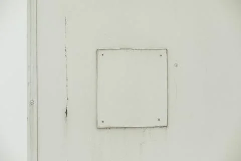 Patch on wall. Texture of white wall with inserts. Broken surface. Stock Photos