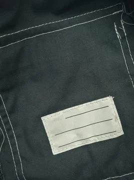 Patch on work clothes to write the name of the owner. Close-up of a clean name Stock Photos