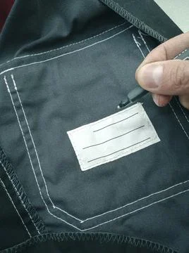 Patch on work clothes to write the name of the owner. Close-up of a clean name Stock Photos