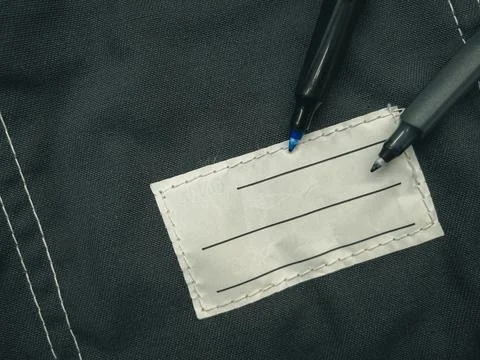 Patch on work clothes to write the name of the owner. Close-up of a clean name Stock Photos