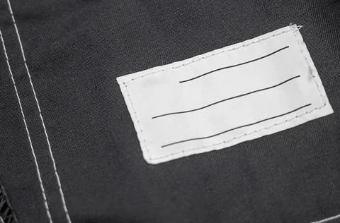 Patch on work clothes to write the name of the owner. Close-up of a clean name Stock Photos