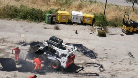 Patching of some holes in the road surface 库存影片 198403387