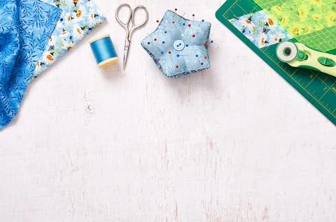 Patchwork accessories, top view on a white wooden surface Fotos de archivo