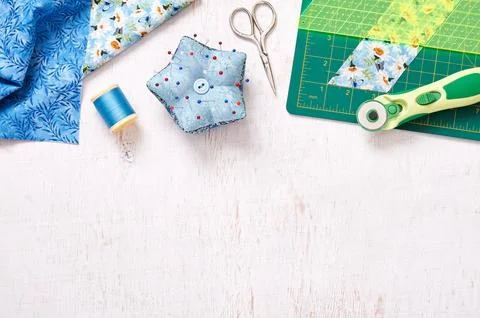 Patchwork accessories, top view on a white wooden surface 스톡 사진