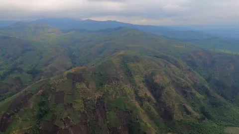 Patchwork of agricultural field plots on steep rolling hills in Congo Video stock 164273936