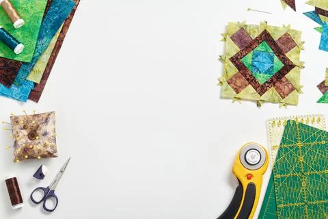 Patchwork block, stack of fabrics, sewing and quilting accessories. Space for 스톡 사진